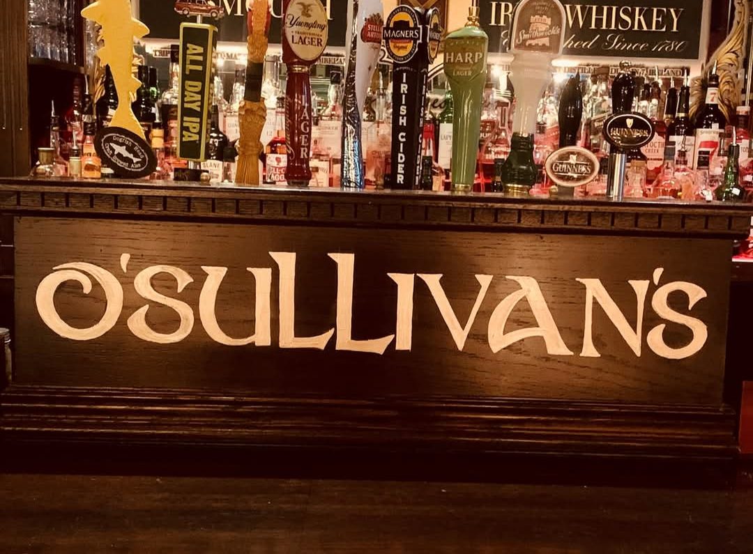 The taps and O'Sullivan's sign at the bar